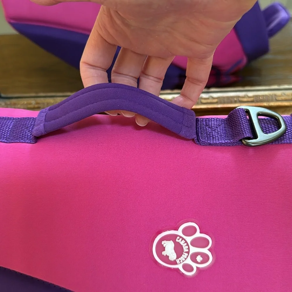 New High Tide life jacket by Canada Pooch for swimming. Pink and Purple. Size 18